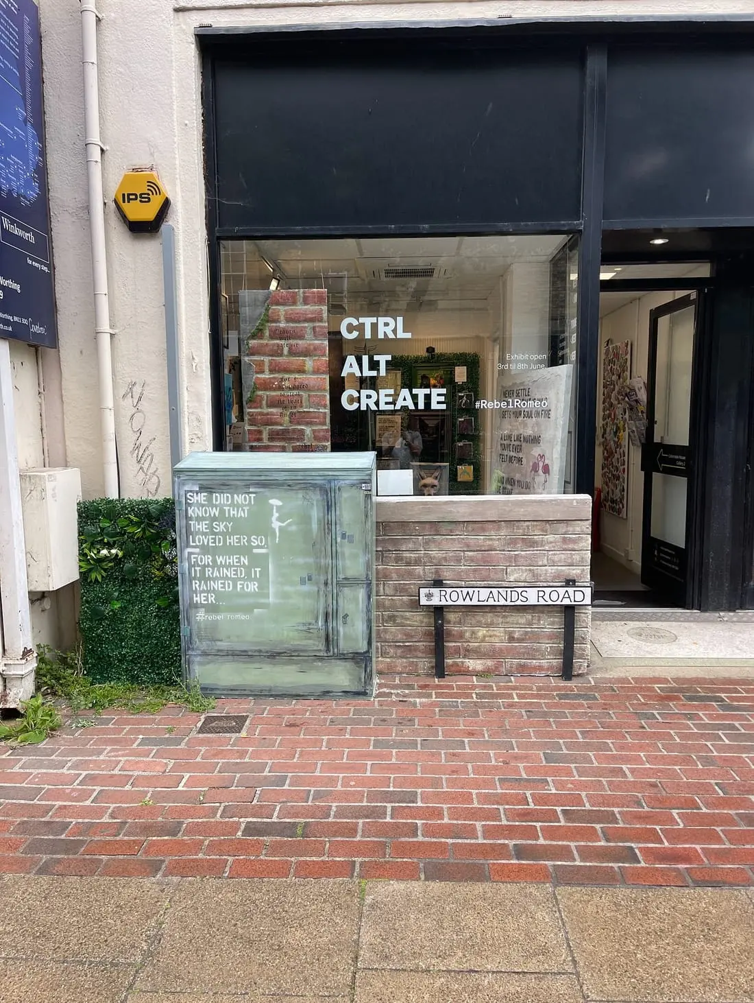 The CTRL ALT CREATE shopfront on Rowlands Road, Worthing, with the She Did Not Know painted cabinet on the pavement outside