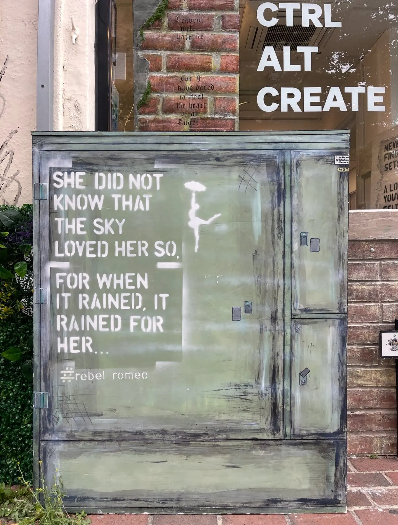 The She Did Not Know painted cabinet standing outside the CTRL ALT CREATE gallery window