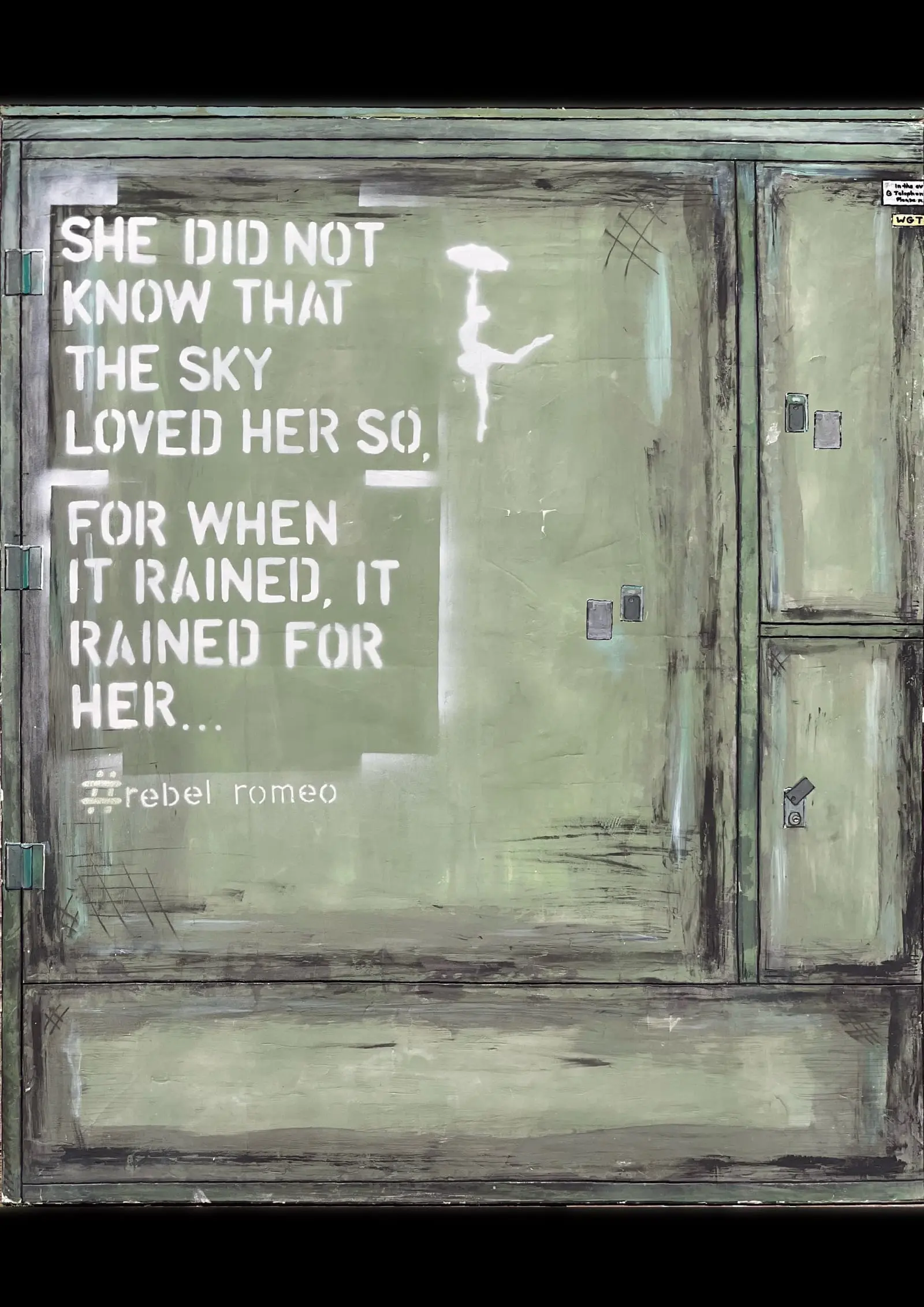 She Did Not Know — white stencilled poem and dancing figure with umbrella on a reclaimed green cabinet